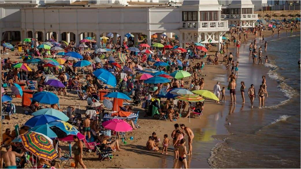 Bathers enjoy the beach in Cadiz, south of Spain, on Friday, July 24, 2020.