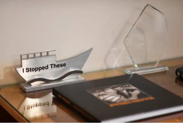 Prime Minister Scott Morrison has a laser-cut block of metal in the shape of an Asian fishing boat displaying the words: "I stopped these" to celebrate his achievements when he was immigration minister.