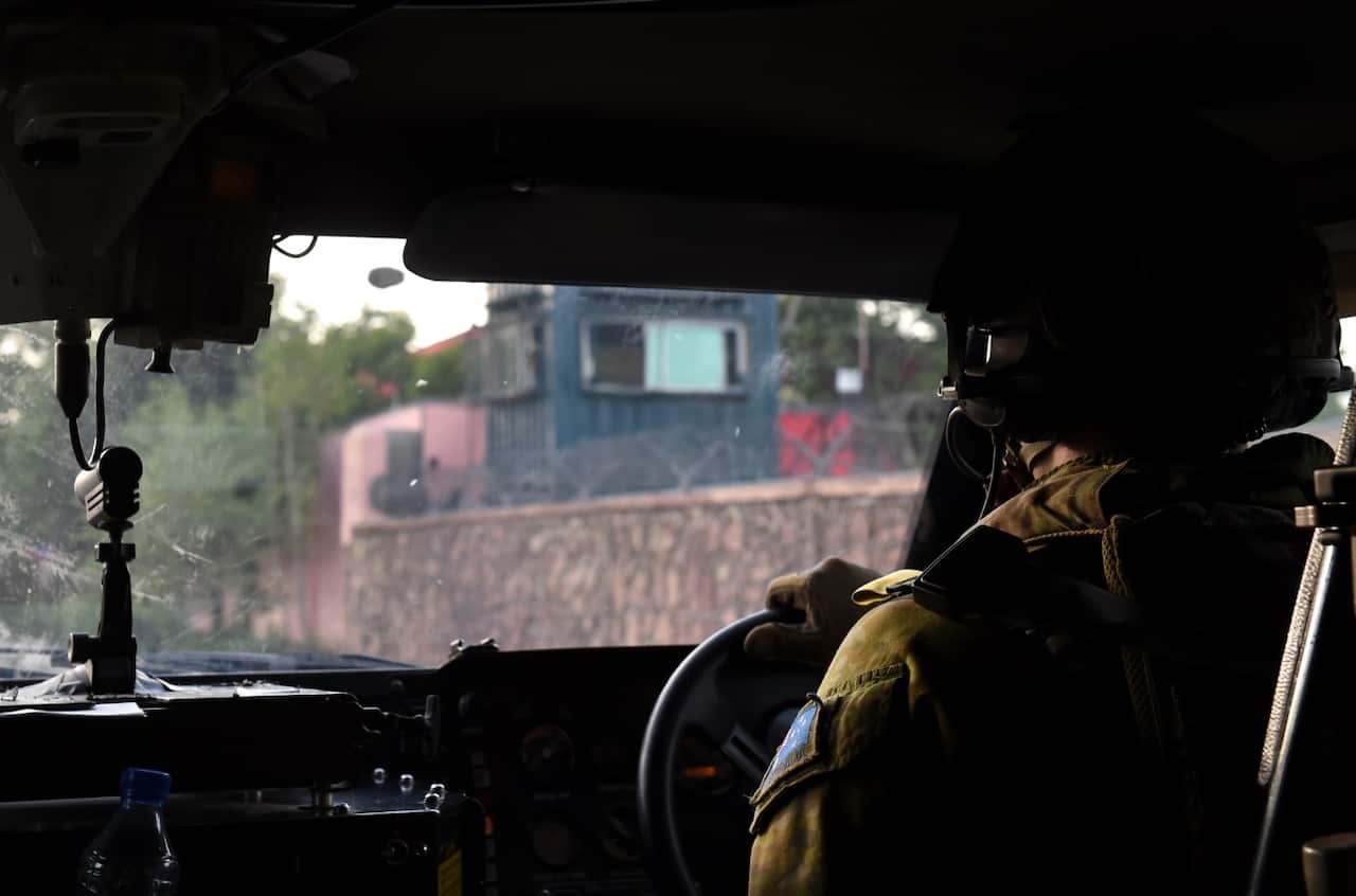 An Australian Defence Force Bushmaster Protected Mobility Vehicle drives through Kabul, Afghanistan on Sunday, April 24, 2016. 