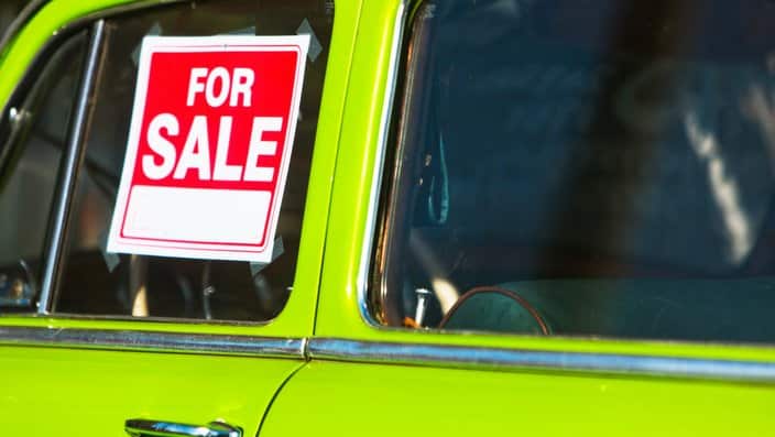 For sale sign on car window