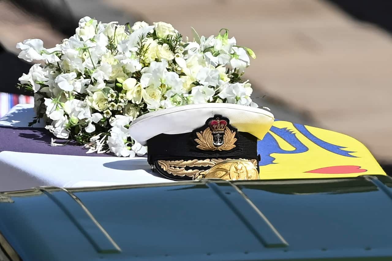 The Royal Navy cap sits on top of the coffin during the funeral of Britain's Prince Philip inside Windsor Castle in Windsor, England Saturday April 17, 2021. (Leon Neal/Pool via AP)