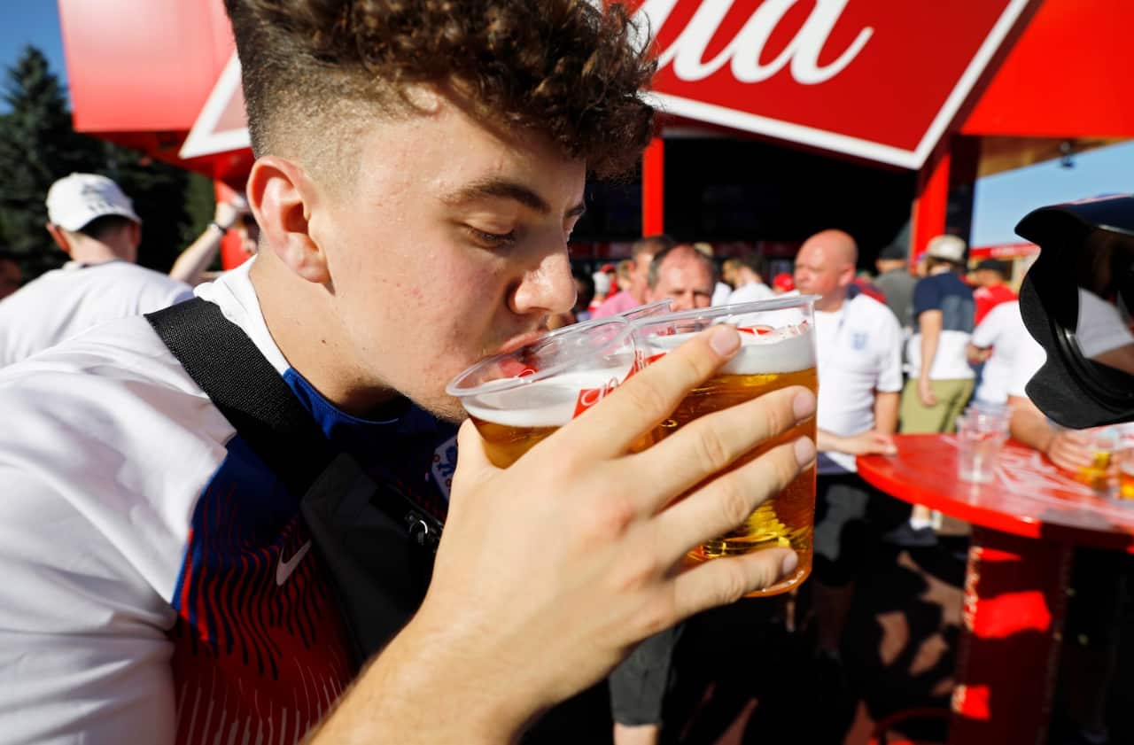 An England fan drinks beer at the FIFA Fan Zone in Volgograd, Russia, 18 June 2018.