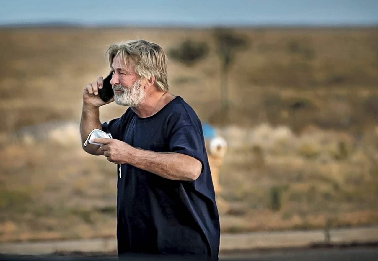 Alec Baldwin speaks on the phone in the parking lot outside the Santa Fe County Sheriff's Office.