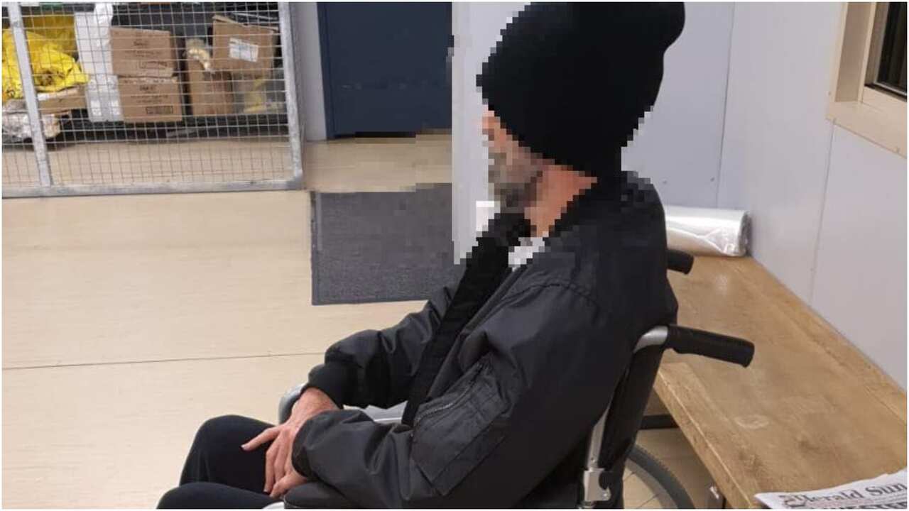 A refugee sits in a wheelchair after taking part in the hunger strike protest. He's since ben released f