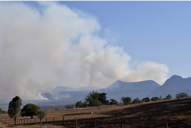 Fires are seen burning in the Main Range National Park near Tarome, south west of Brisbane. AAP