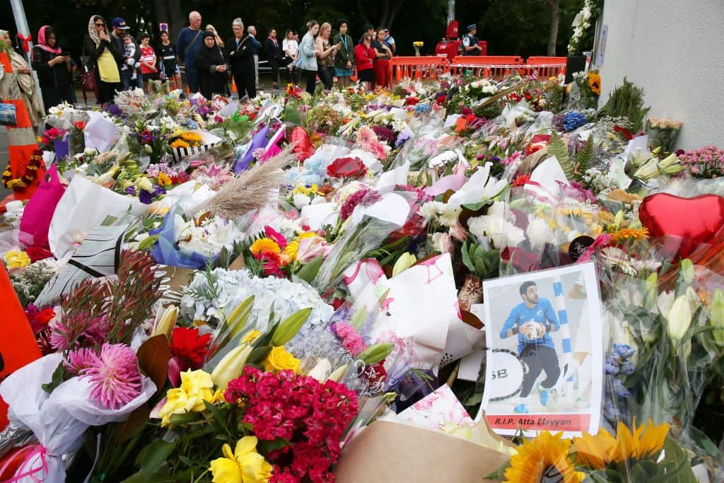 A picture of New Zealand futsal player Atta Elayyan, victim of the Christchurch mosque attacks, is seen at a floral tributes near Al Noor mosque in Christchurch on March 18, 2019, four days after 50 worshippers were killed in two mosques attacks, the wors
