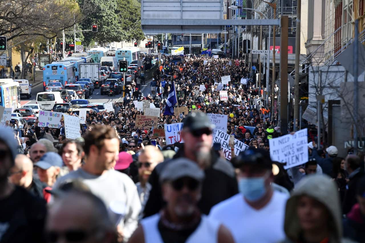 Anti-lockdown protesters march along Broadway and George St towards Sydney Town Hall on 24 July 2021.