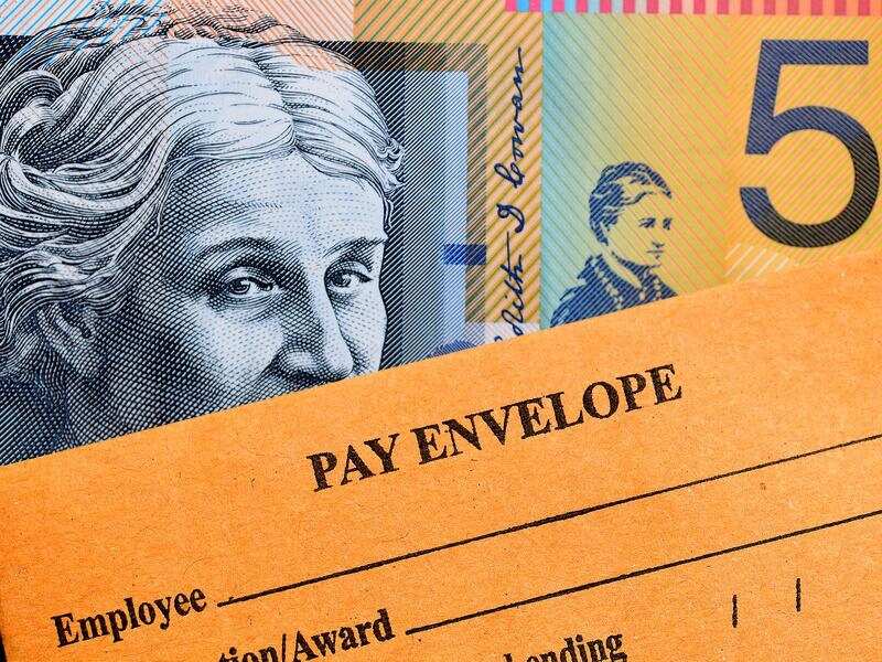 A stock image of Australian currency and a wages envelope.