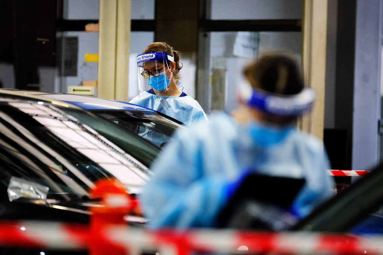 Health workers conduct COVID-19 testing at the Montague St centre in South Melbourne.   