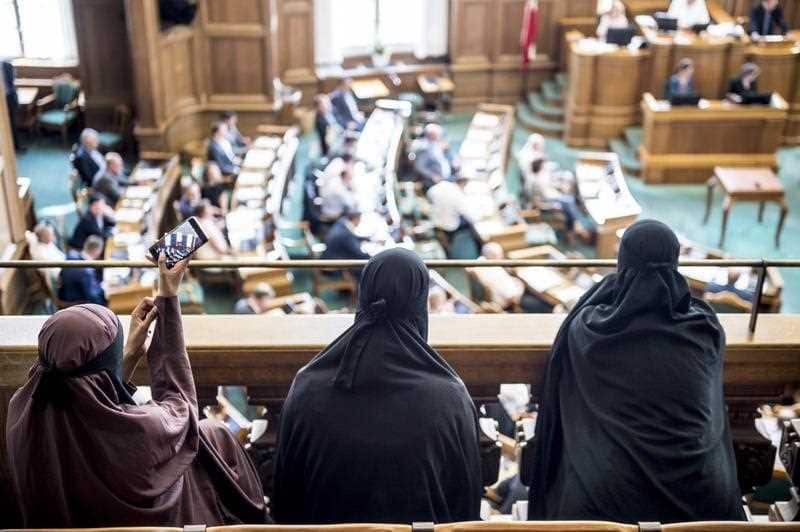 Women in niqab in the audience seats listens to the Danish Parliament at Christiansborg Castle in Copenhagen, Denmark, 31 May 2018.