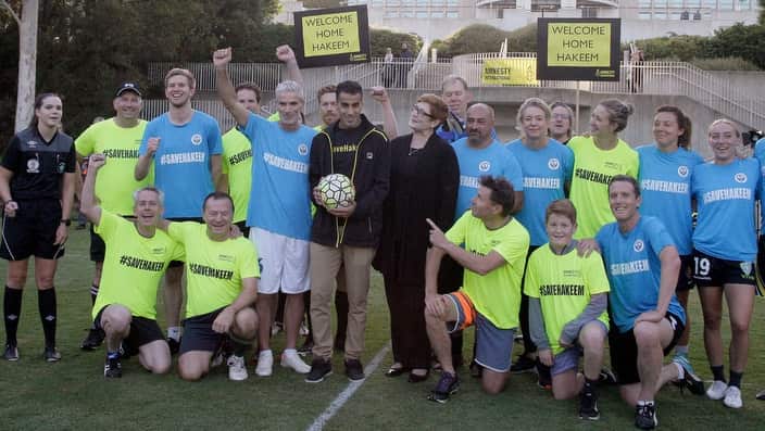 Hakeem al-Araibi, Craig Foster and Foreign Minister Marise Payne with soccer teams at Parliament House in Canberra