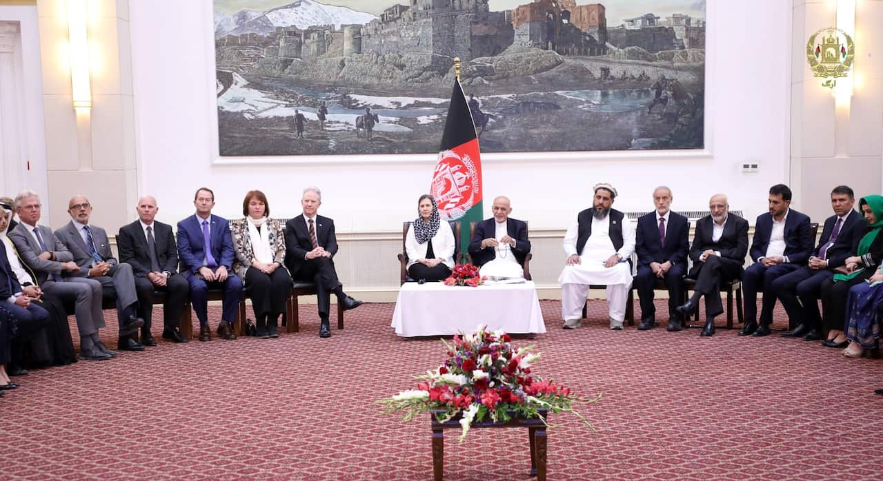 Afghan President Ashraf Ghani (c) along with delegations from both countries commemorating 50 years of diplomatic relations.