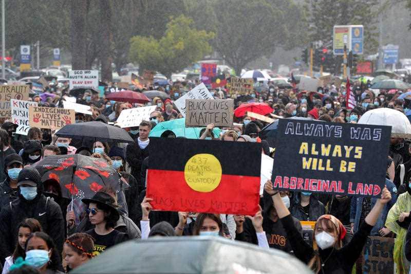 Protesters participate in a Black Lives Matter rally at Langley Park in Perth, Saturday, June 12, 2020