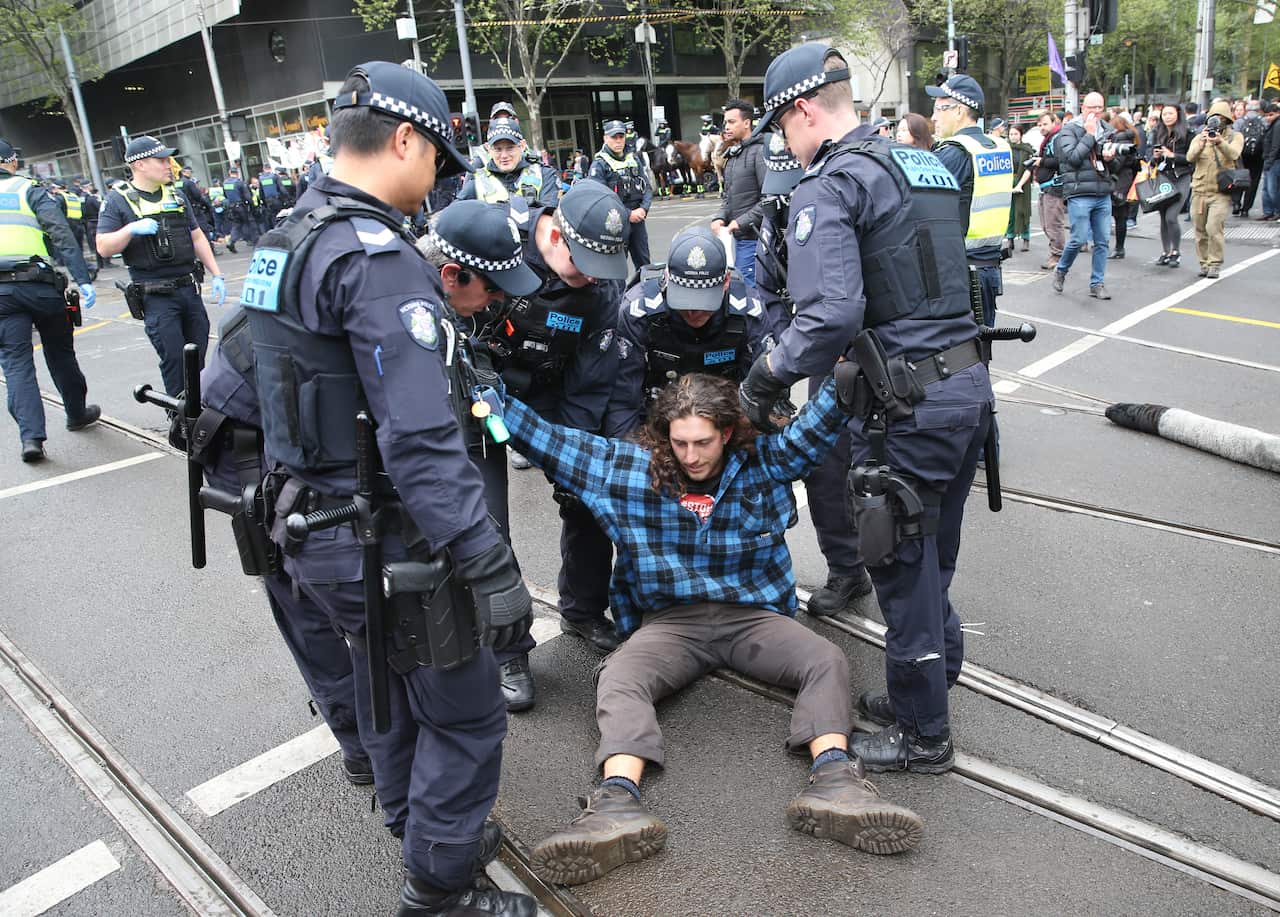Activists from Extinction Rebellion participate in a protest in Melbourne on the intersection of Spencer and Collins street.