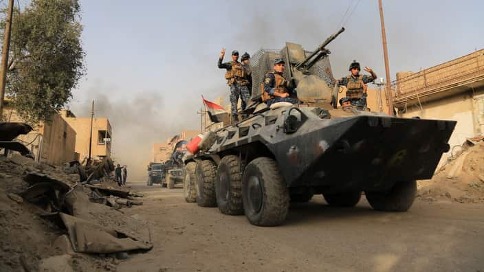 Iraqi forces patrol the Farouq neighborhood in Mosul on July 3, 2017