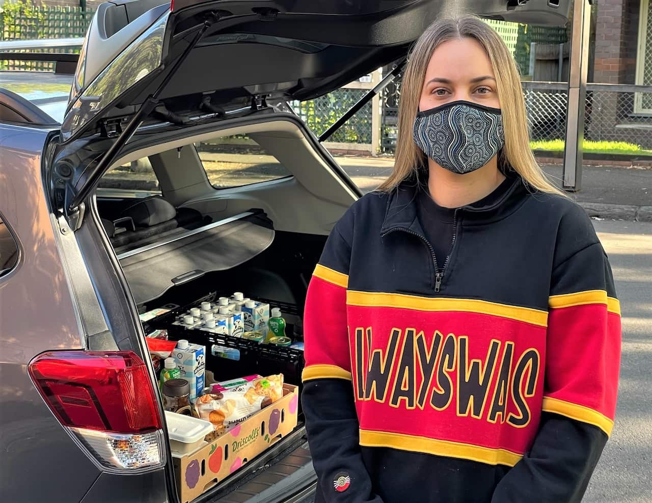 Coral Lever delivering meals to Aboriginal families in Sydney this week.