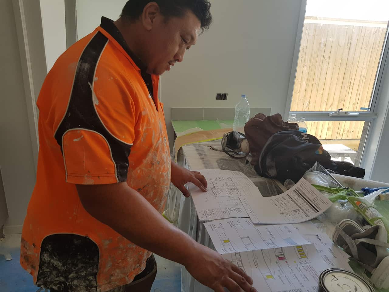 Checking house plan for painting - Chong Cheng Thao