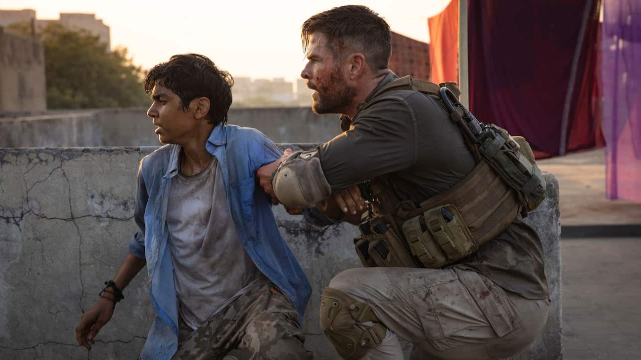 Chris Hemsworth and in Rudhraksh Jaiswal in a scene from "Extraction"