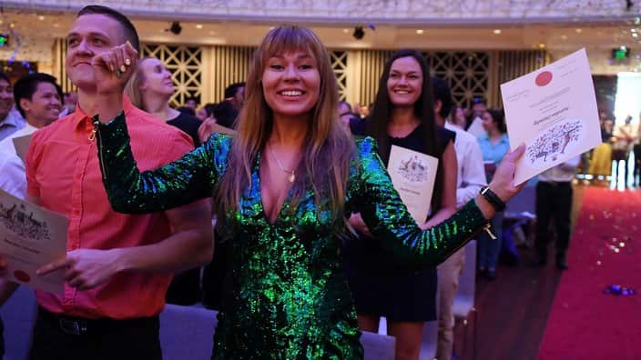 Australian citizenship recipients and their guests attend a citizenship ceremony on Australia Day in Brisbane, Thursday, Jan. 26, 2017. (AAP Image/Dan Peled) NO ARCHIVING