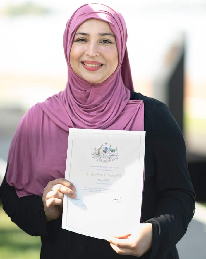 Australian Citizen Hina Asim attends the flag raising and Citizenship ceremony at Lake Burley Griffin on January 26, 2020 in Canberra, Australia. 