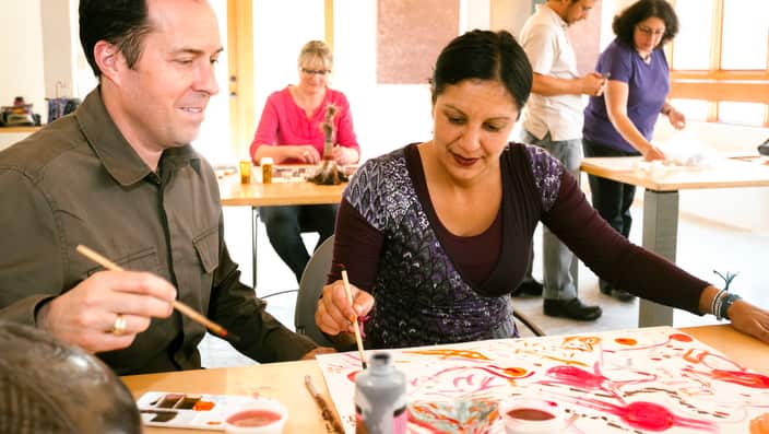 People painting in art class