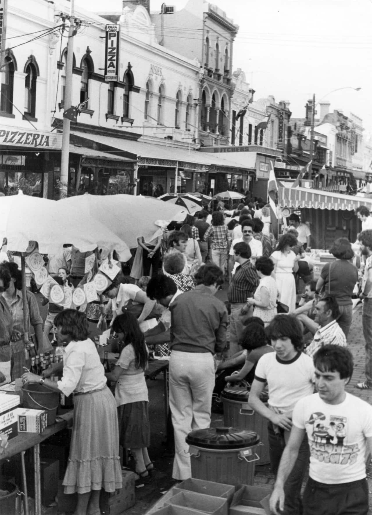 Stall holders and members of the public enjoying the 1979 Lygon Street Festa. 