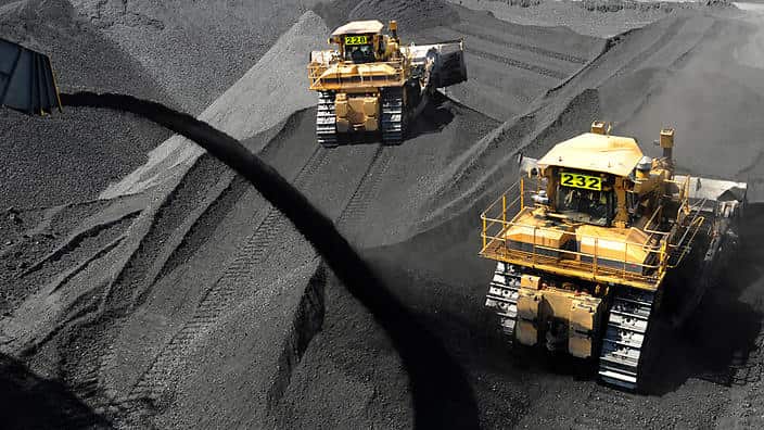Coal is stockpiled before being loaded on to ships at the RG Tanner Coal Terminal in Gladstone, Friday, Jan. 20, 2012. The Terminal plays a vital role in delivering coal supplies to foreign markets. (AAP Image/Dave Hunt) NO ARCHIVING