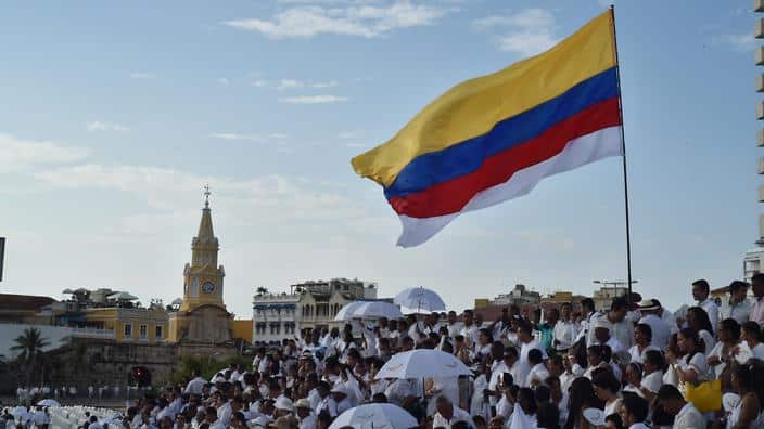 Some of the attendees who were invited to wear white and witness the signing of the historic peace agreement