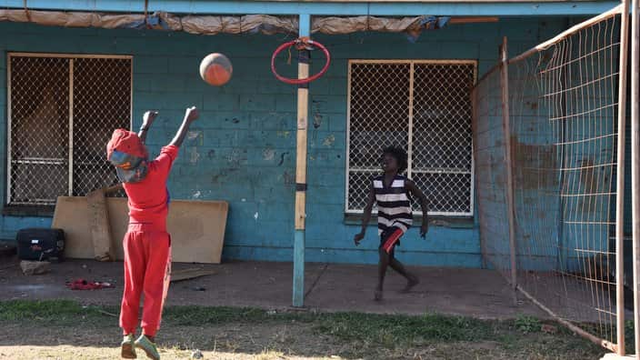 Children play basketball in Arnhem Land, NT