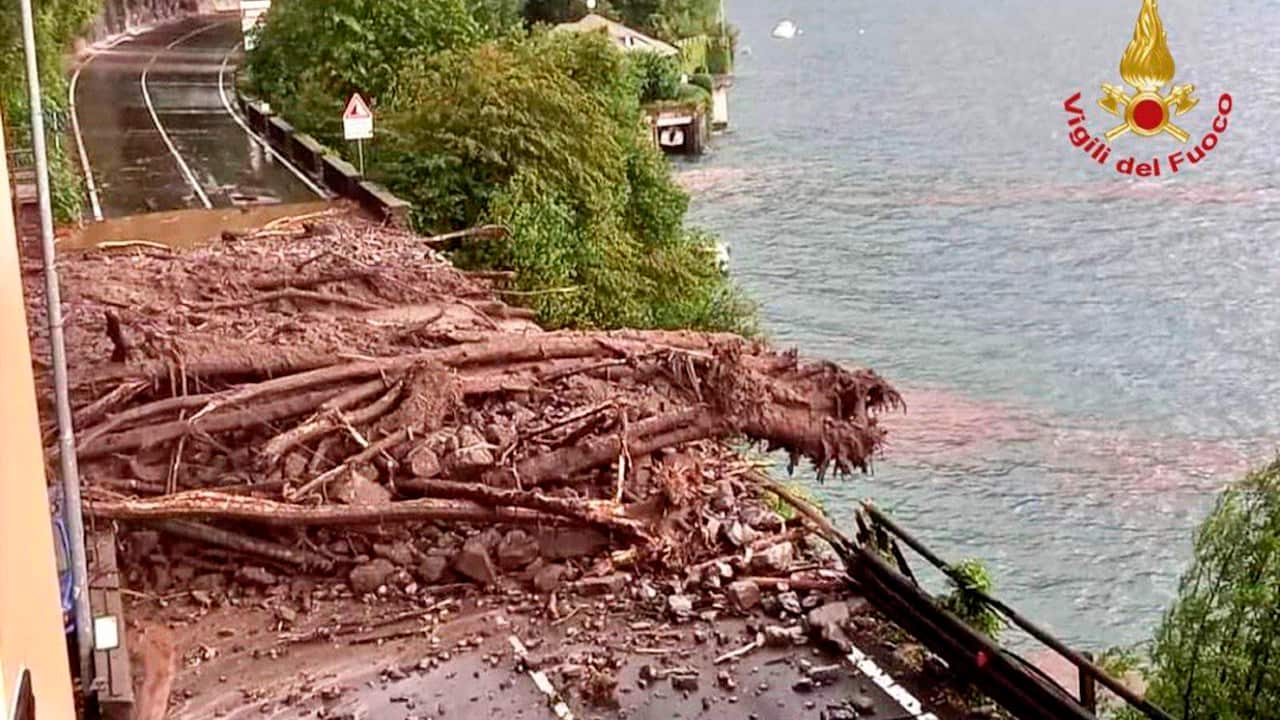 Mud and trees block a road in the Lake Como area, northern Italy, Tuesday, July 27, 2021. 