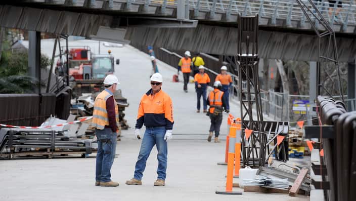 Workers finalize the new walk bridge