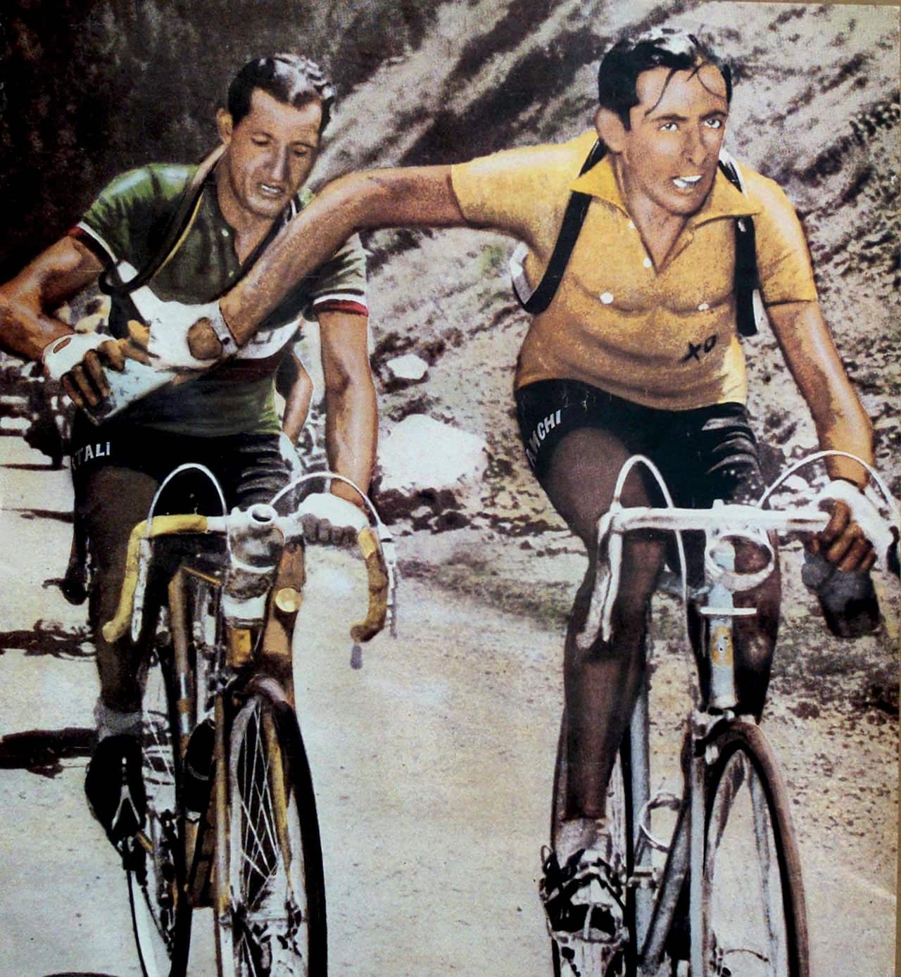The most famous photo showing the passing-over of a water bottle between Italian cyclists Gino Bartali (L) and Fausto Coppi during a stage of the Tour de France of 1949