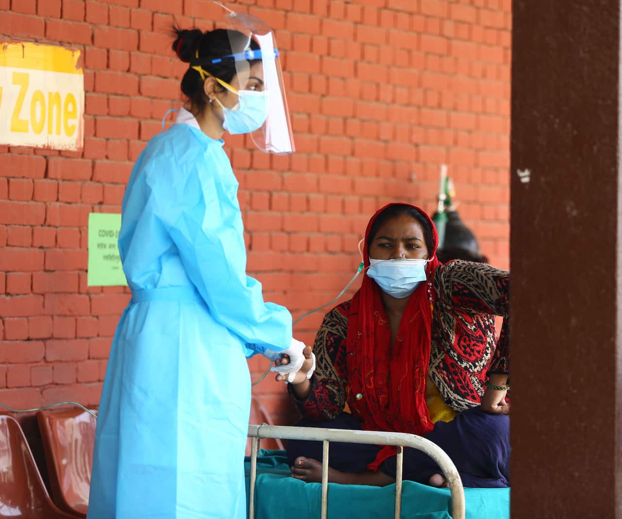 A patient is treated at a hospital in Kathmandu amid increasing cases of coronavirus