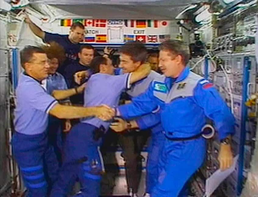 US Astronaut James Voss (far left) shakes hands with astronaut Bill Shepherd (far right) Russian cosmonauts Yuri Usachev (left) and Sergei Krikalev (right) hug at the International Space Station in 2001. It was launched in 1998 at a time of hope for US-Ru