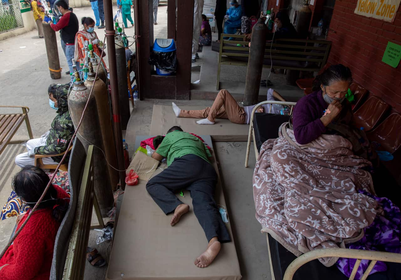 Covid-19 patients are being treated outside a hospital after Covid-19 wards are fully occupied at hospitals in Kathmandu, Nepal.