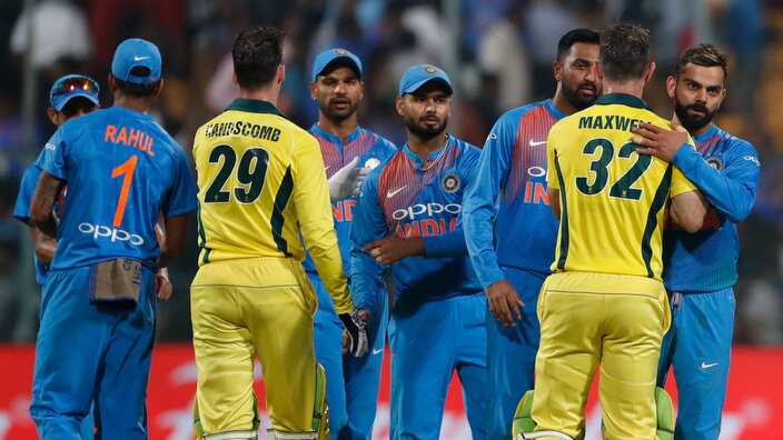 India's captain Virat Kohli, right, hugs Australia's Glenn Maxwell to congratulate him on their win in the second T20 international cricket match between India and Australia in Bangalore, India, Wednesday, Feb. 27, 2019. (AP Photo/Aijaz Rahi)