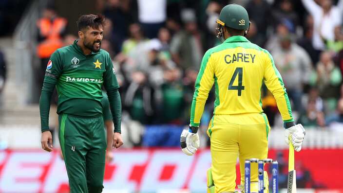 Pakistan's Mohammad Amir and Australia's Alex Careys exchange words during the ICC Cricket World Cup at Taunton.