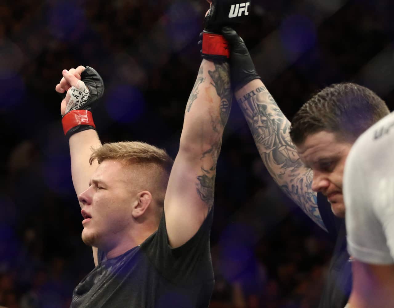 Feb 9, 2019; Melbourne, Australia; Jimmy Crute (red gloves) defeats Sam Alvey (blue gloves) during UFC 234 at Rod Laver Arena. Mandatory Credit: Jasmin Frank-USA TODAY Sports/Sipa USA.