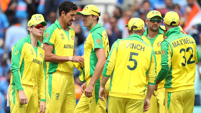 Australia's Mitchell Starc, second left, celebrates with teammates the dismissal of India's Shikhar Dhawan during the Cricket World Cup match between Australia and India at The Oval in London, Sunday, June 9, 2019. (AP Photo/Aijaz Rahi)