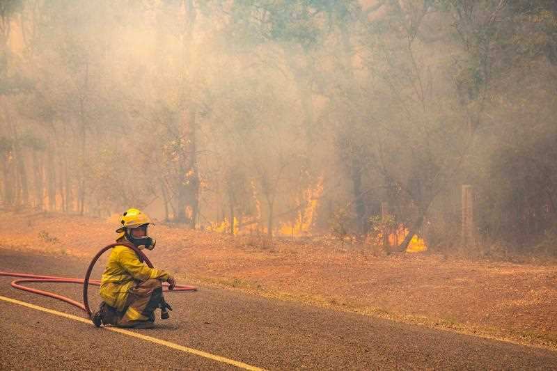 Firefighters working to control a bushfire in Deepwater, Central Queensland.