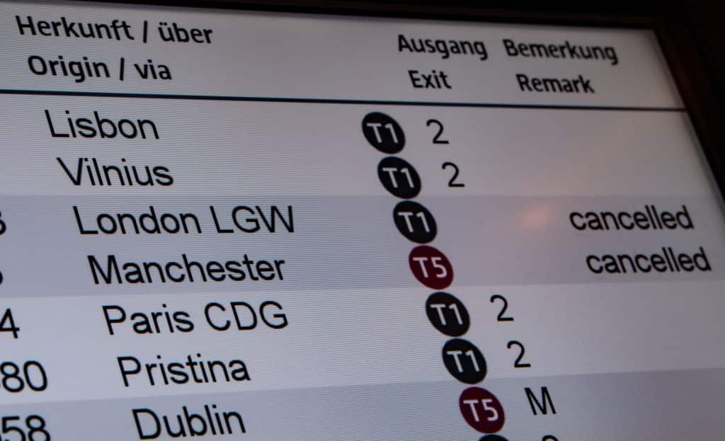 The information board at Berlin Airport, Germany shows flights from the UK are cancelled.