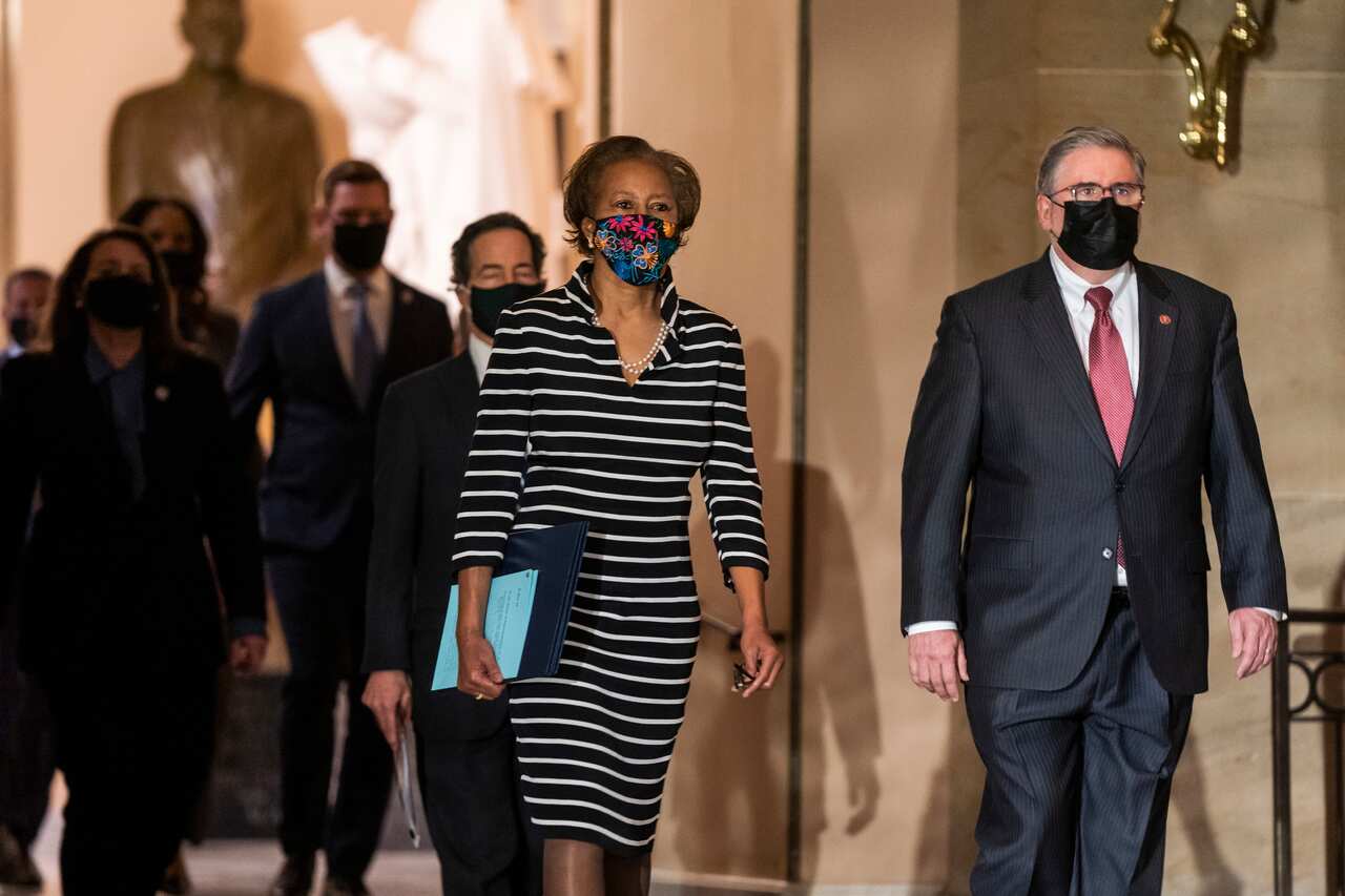 Clerk of the House of Representatives Cheryl Johnson carries the article of impeachment through the US Capitol in Washington, DC, USA, 25 January 2021.