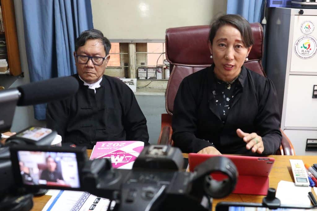 Min Min Soe (R) and Khin Maung Zaw (L), lawyers representing detained Myanmar leader Aung San Suu Kyi, address members of the media.