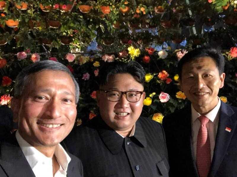 Singapore's Foreign Minister Vivian Balakrishnan (L) via Twitter shows him posing for a selfie with North Korean leader Kim Jong-un (C) and Singapore's Education Minister Ong Ye Kung (R).