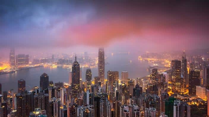 Night view of skyscrapers and high-rise buildings in Central along the Victoria Harbor in Hong Kong, China, 17 April 2017. (AAP)