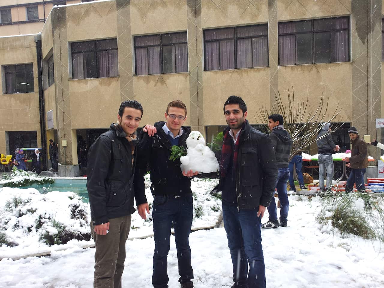 Omar Al-Kassab (L) poses with his friends Emad (C) and Bilal (R) in Syria.