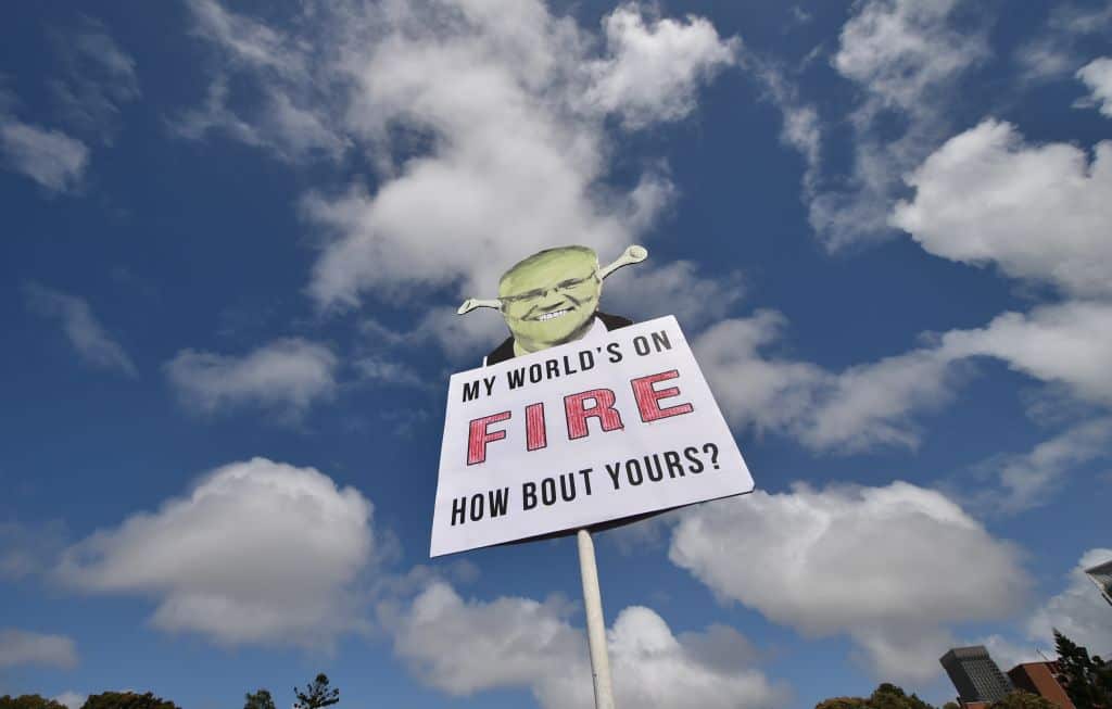  A placard depicting Australia's Prime Minister Scott Morrison is displayed during the world largest climate change protest  on September. 