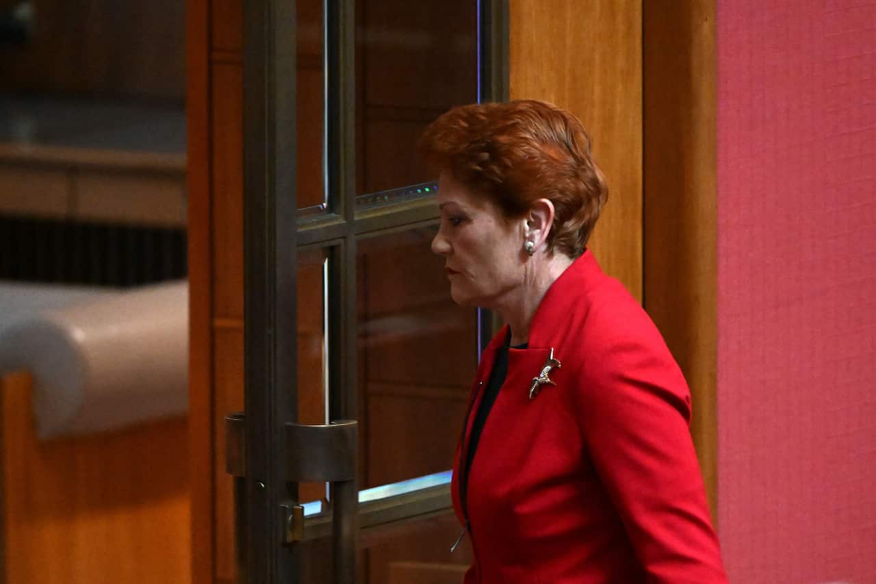 One Nation leader Pauline Hanson walks out after reacting to President Sue Lines acknowledgement of country in the Senate chamber in Canberra, Wednesday, July 27, 2022. (AAP Image/Mick Tsikas) NO ARCHIVING