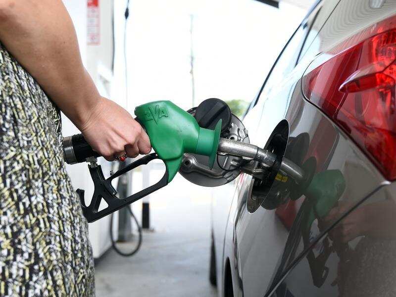 A motorist refuels her car