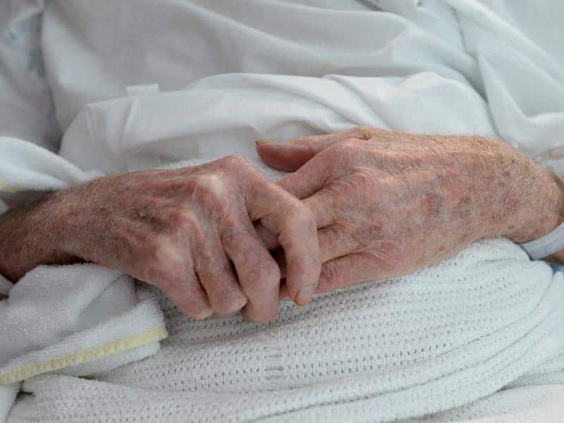 An elderly patient's hands